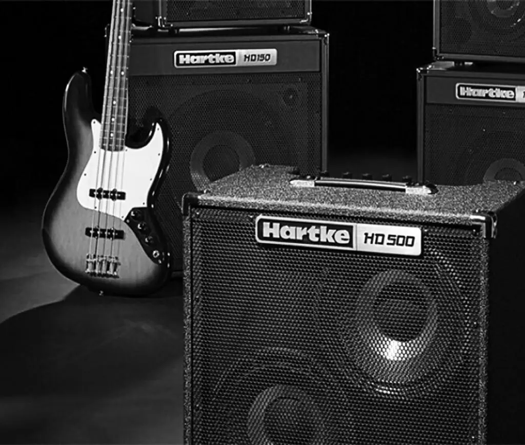 This image features a bass amplifier, a key asset in bass tracking. Enclosed in its rugged casing, the amplifier's technology enriches and amplifies the bass guitar's tones, thereby adding depth and character to the recording.