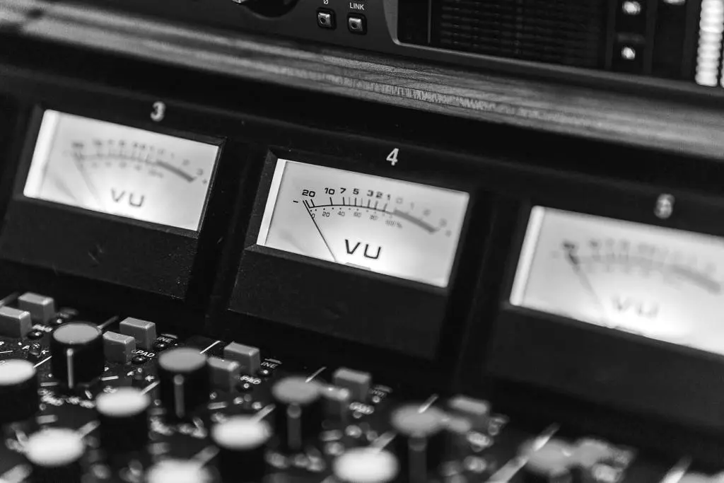 A compressor evens out the volume of audio by automatically decreasing the level of peaks and increasing the level of quieter parts.