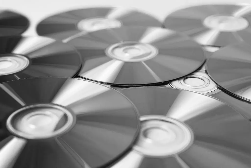 CD stands for compact disc, an optical data storage format for storing digital information like music, images, documents or programs on a durable plastic disc.